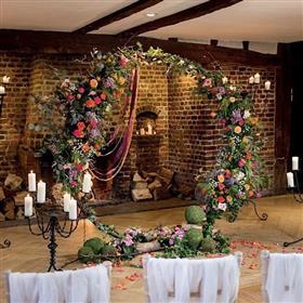 fwthumbCeremony flowers, Great Fosters, Moongate colourful, ribbons.jpg